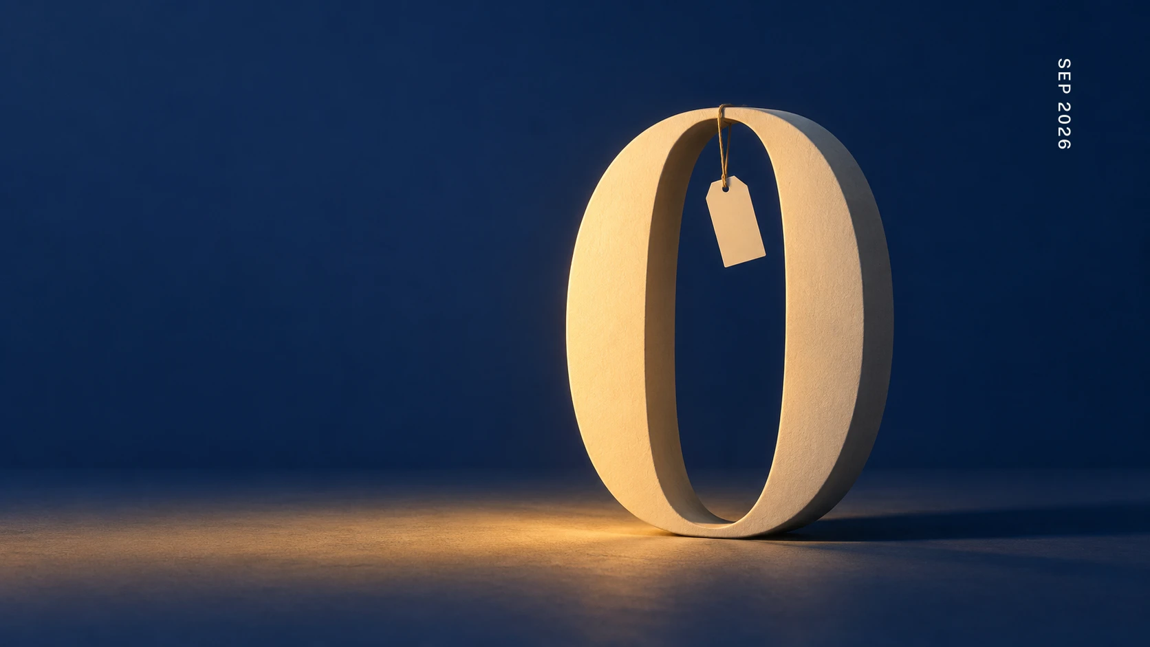 A sculptural cream zero standing in a deep blue room, lit warm from below, a blank price tag hanging from its top